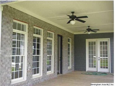 Outdoor patio w/ french doors to Master Suite & Li