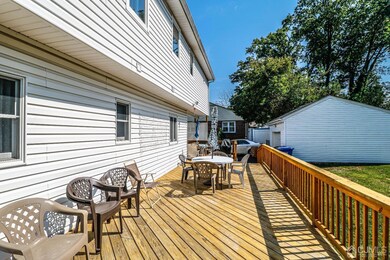 Huge deck runs across the entire length of the back of this lovely well maintained home.