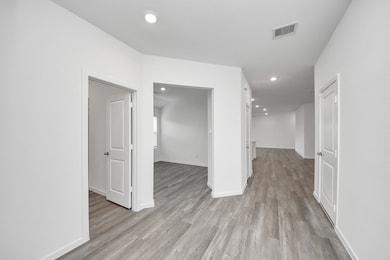 Expansive entrance with elegant flooring.