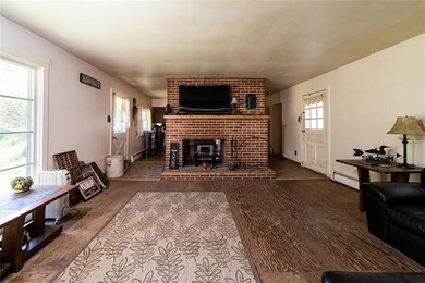 LIVING ROOM WITH DOUBL FIREPLACE ACCESSING KITCHEN