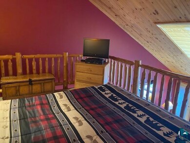 Bedroom with wooden ceiling