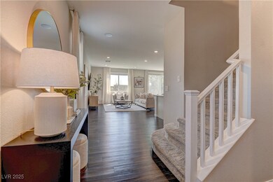 Foyer featuring dark wood finished floors, stairwa