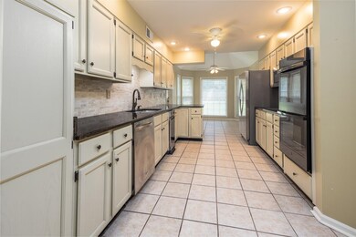 Bright kitchen with view of back yard.