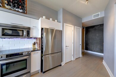 Kitchen featuring stainless steel appliances, whi