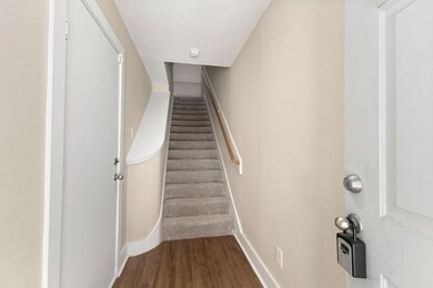 The entry way offers plenty of space for entry furnishings and a door on the left to the garage.