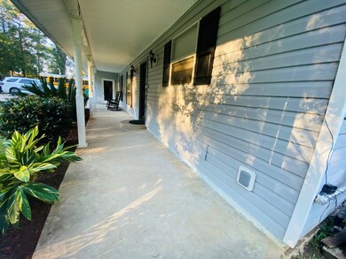 Large front porch with door access to garage 