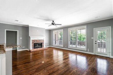 Unfurnished living room with ceiling fan, ornament