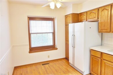 Eating area of kitchen. Nice laminate flooring, oa