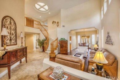 Foyer with elegant tile flooring opens to formal l