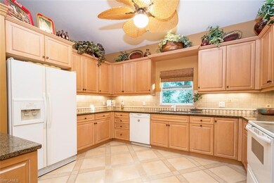 Large Kitchen w/ Cinnamon Maple Cabinetry & Breakf