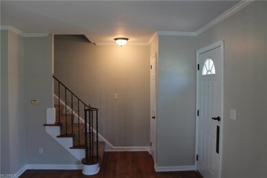 foyer/entrance with natural hardwood floors