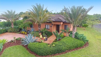 CUTE SMALLER HOUSE WITH LOTS OF LAND...LAND IS SPLIT IN 2 WITH SERVICE ENTRANCE FOR ALL SELLERS WORK EQUIPMENT