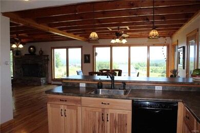 Kitchen looking out to dining and living areas wit