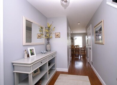 Inviting front entry with pine floors.