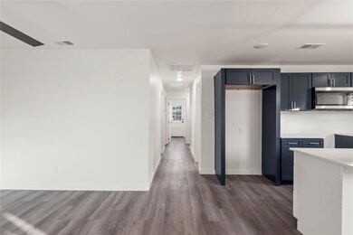 Kitchen featuring dark wood-type flooring