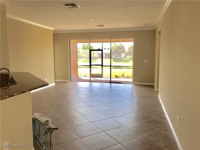 Tiled spare room with ornamental molding