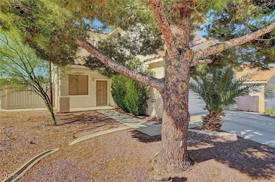 Obstructed view of property featuring stucco sidin