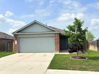 Ranch-style house featuring a front yard, brick s