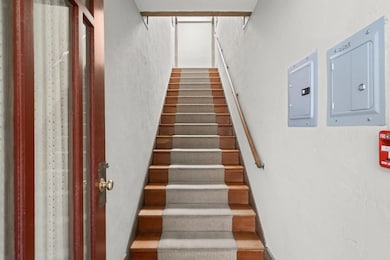 Staircase to the two upper floor units.