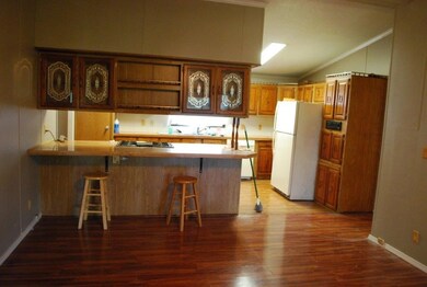 Kitchen open to family room, lots of built in cabinets.