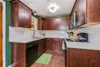 The on-trend and beautifully executed backsplash fully compliments the quartz counters.