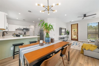 Dining space with recessed lighting, ceiling fan 