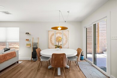 Dining space with visible vents, light wood-style