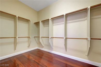 Walk in closet featuring wood finished floors