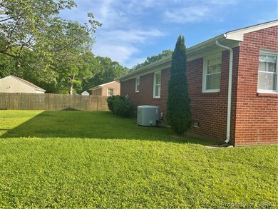 Back of home showing brick siding