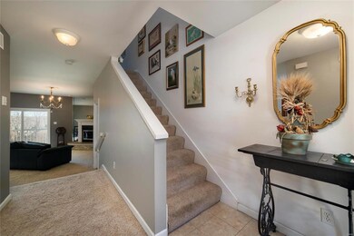 Entryway is tiled & opens into living room area.