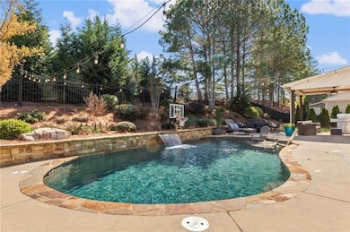 Outdoor oasis with pebbletec saltwater pool!
