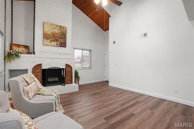 Great Rm /Living room featuring ceiling fan, a fireplace, high vaulted ceiling, new baseboards, and luxury vinyl flooring