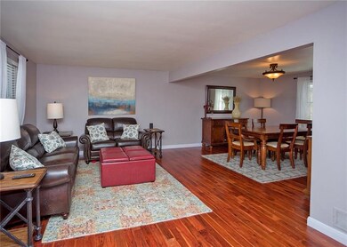 The open concept living room and dining room offer