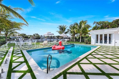 View of swimming pool featuring a patio, a water v