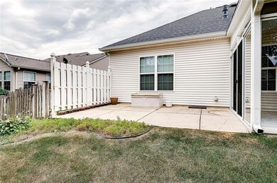 PATIO WITH WHITE FENCING FOR PRIVACY. 
