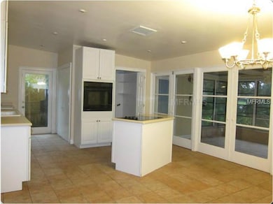 Kitchen - 3 sets of French Doors led out to enclosed patio off of the kitchen/dining for effortless entertaining!