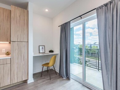 Office featuring light wood-style flooring, reces
