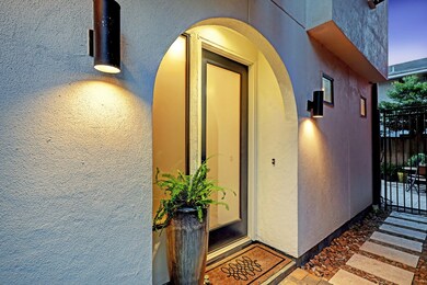 Arched entrance with pavers leading to your privat