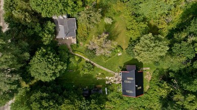 Aerial view of house and separate studio.