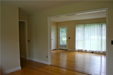 Gleaming hardwoods greet you in the living room
