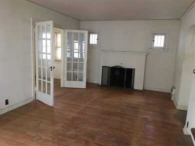 Living Room with wood burning fireplace.