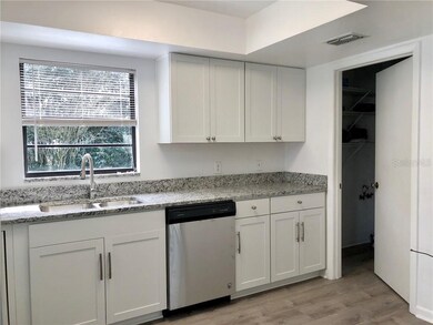 Kitchen with attached laundry room