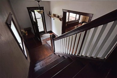 Front Stairs/Foyer. Hardwood flooring has been tho