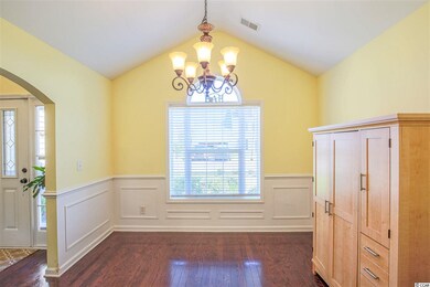 Formal Dining Room with cathedral ceiling