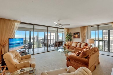 Living room featuring light carpet, plenty of natu