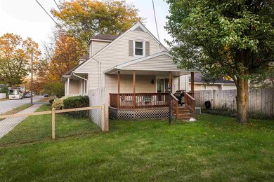 Fenced in backyard with covered deck