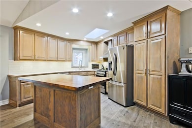 Kitchen with appliances with stainless steel finis