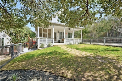 View of yard with a fenced backyard, a ceiling fa
