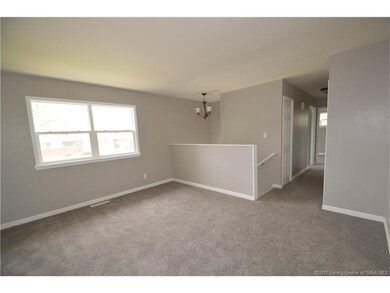 Living room offers plenty of natural light. New ca