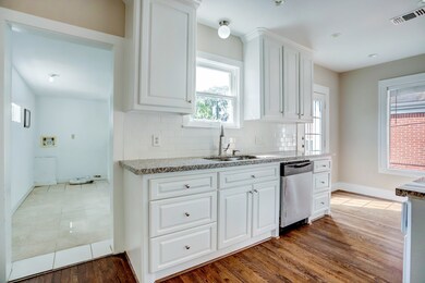 Additional view of kitchen and utility room. *Wash